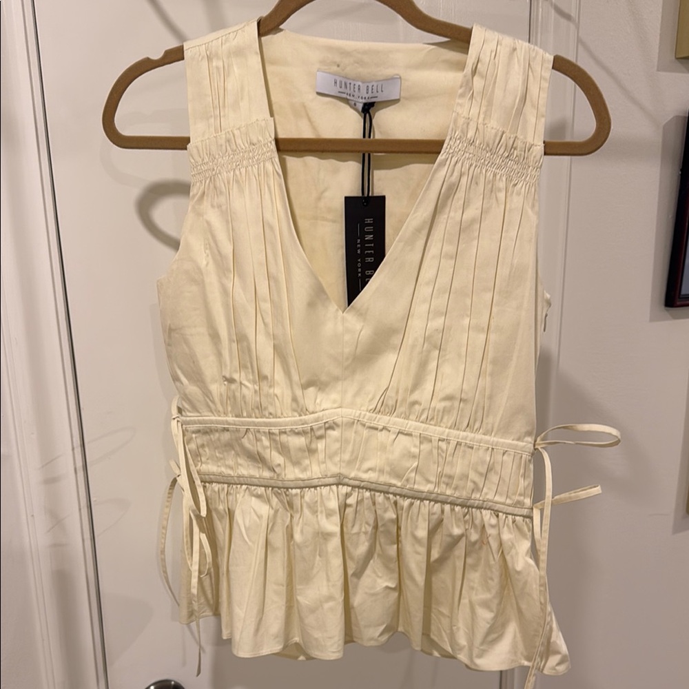 Cream Sleeveless Peplum Blouse with Tie Front